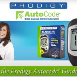 Prodigy glucose meter in use: applying blood to test strip.