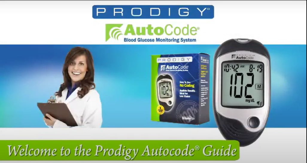 Prodigy glucose meter in use: applying blood to test strip.